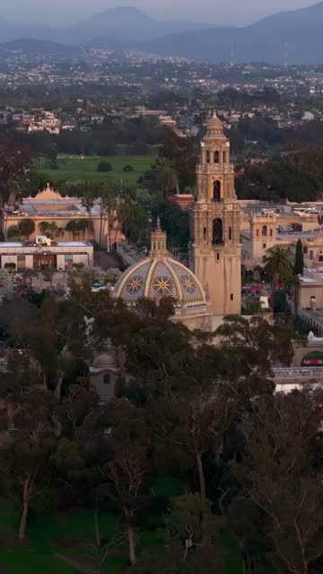 Aerial footage of Balboa Park California Tower and Cabrillo Bridge during a beautiful sunset over Bankers Hill | Vertical Drone Video – 1