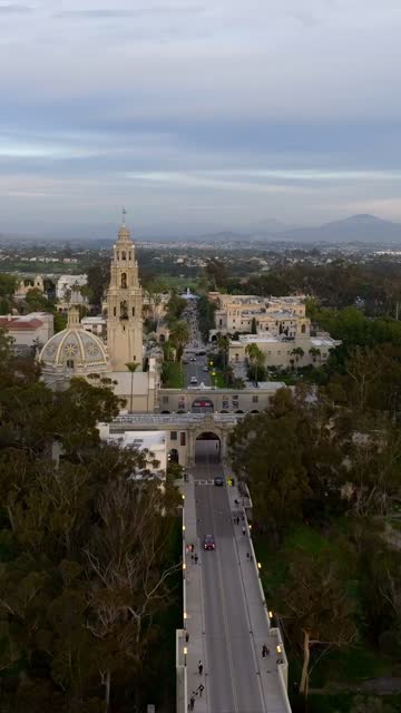 Aerial footage of Balboa Park California Tower and Cabrillo Bridge during a beautiful sunset over Bankers Hill | Vertical Drone Video – 2