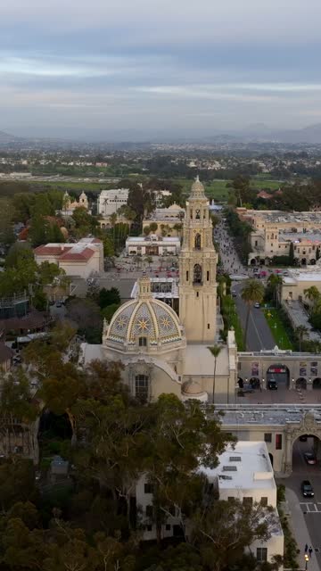 Aerial footage of Balboa Park California Tower and Cabrillo Bridge during a beautiful sunset over Bankers Hill | Vertical Drone Video – 3