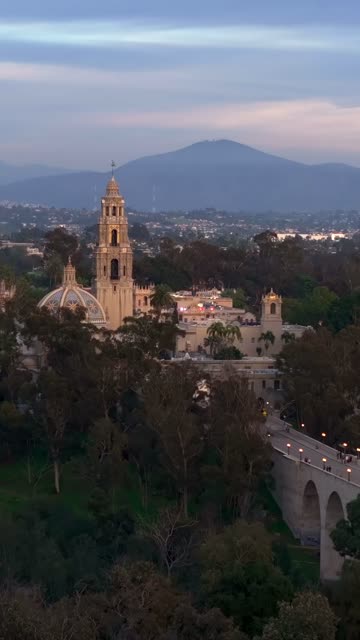 Aerial footage of Balboa Park California Tower and Cabrillo Bridge during a beautiful sunset over Bankers Hill | Vertical Drone Video – 5