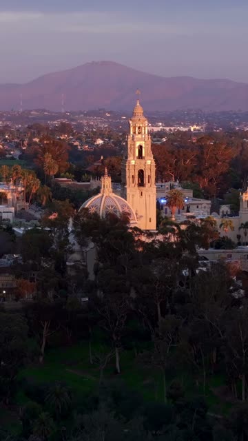 Aerial footage of Balboa Park California Tower and Cabrillo Bridge during a beautiful sunset over Bankers Hill | Vertical Drone Video – 6