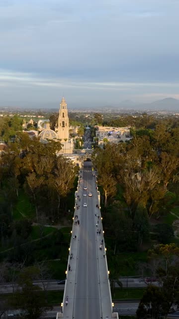 Aerial footage of Balboa Park California Tower and Cabrillo Bridge during a beautiful sunset over Bankers Hill | Vertical Drone Video – 8