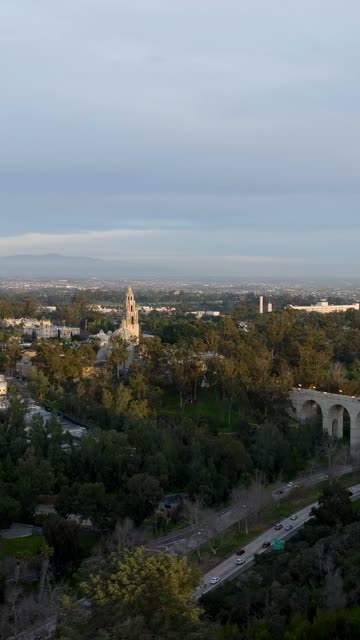 Aerial footage of Balboa Park California Tower and Cabrillo Bridge during a beautiful sunset over Bankers Hill | Vertical Drone Video – 9