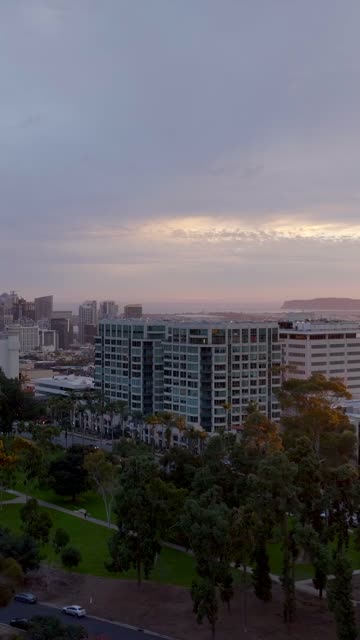 Aerial footage of the Park Laurel Building during a beautiful sunset over Balboa Park and Bankers Hill | Vertical Drone Video – 1