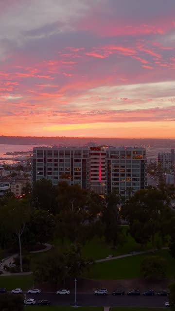 Low aerial view of the downtown streets, the bay and the buildings at Bankers Hill.