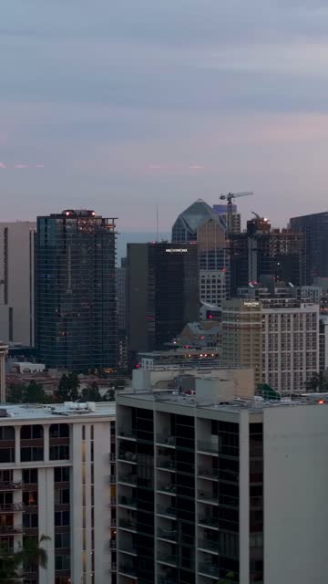 Low aerial view of the downtown streets, the skyline and the buildings at Bankers Hill.