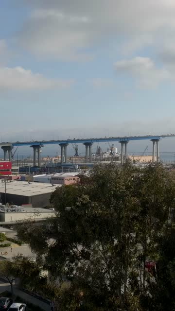 Low aerial view of the harbor, the bridge and boats in Barrio Logan.