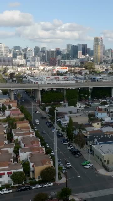 Aerial view of a residential street, the bridge and the skyline in Barrio Logan.