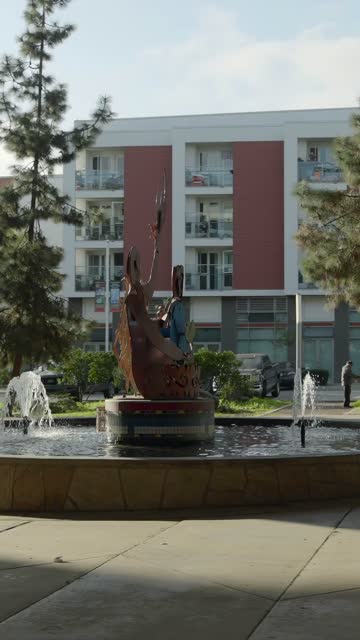 A park, the buildings and traffic in Barrio Logan.