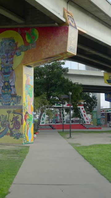 A park, the bridge and the buildings in Barrio Logan.