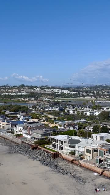 Aerial view of a residential street, wildlife and homes at Powerhouse Park.