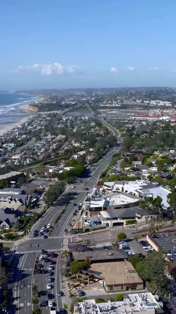 Aerial view of a residential street, the ocean and homes in Del Mar.