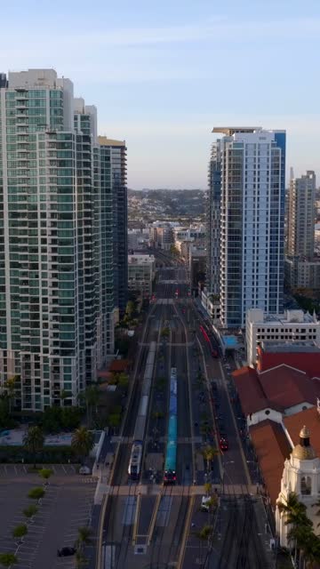 Low aerial view of the downtown streets, the skyline and palm trees at Columbia.