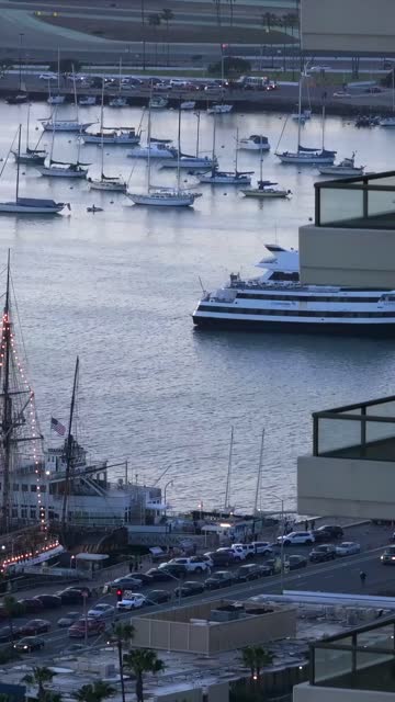 View of the San Diego bay from Downtown San Diego during Sunset | Vertical Drone Video
