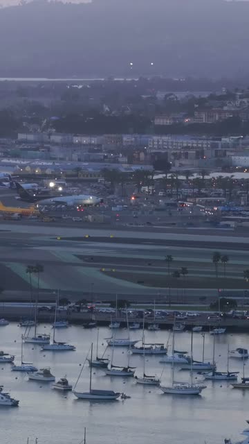 View of the San Diego bay from Downtown San Diego during Sunset | Vertical Drone Video – 1
