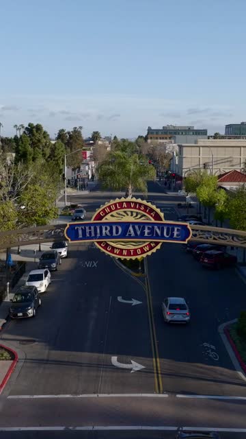 Low aerial view of the downtown streets, palm trees and the buildings in Chula Vista.
