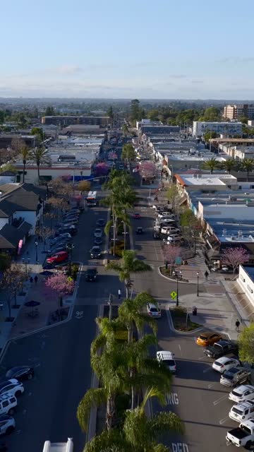 Shot of downtown Chula Vista and the Third Avenue Sign with the Restaurants and Shops | Vertical Drone Video – 8