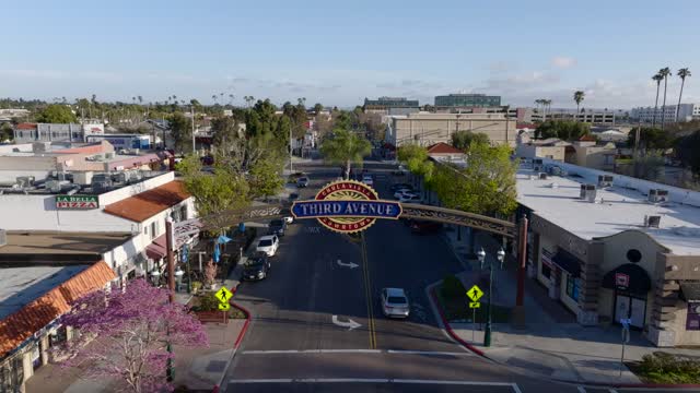 Low aerial view of the downtown streets, palm trees and the buildings in Chula Vista.