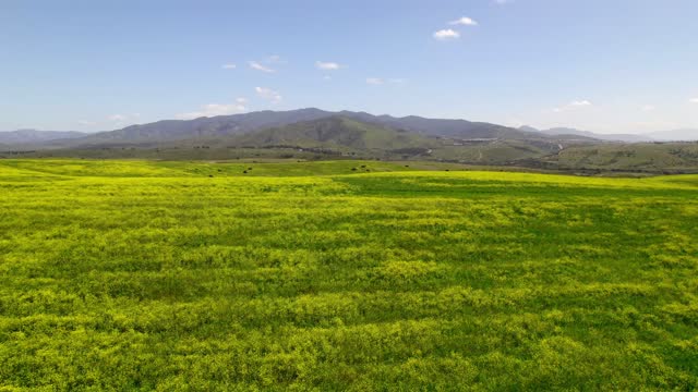 Low aerial view of the country inland and open country in Chula Vista.