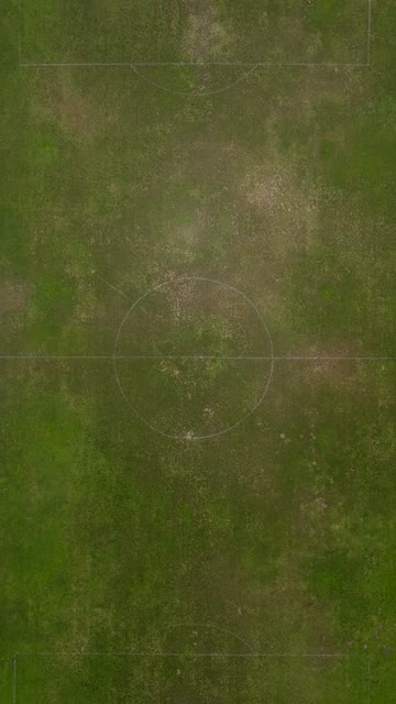 Drone flyover of the soccer field and basketball courts at Vista Magnet Middle School in Vista | Vertical Drone Video