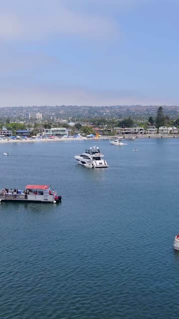 Aerial view of the harbor, boats and the bay in Mission Bay, with boats out.