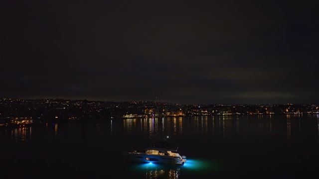 Aerial view of the beach, boats and the bay in Mission Bay, with boats out.