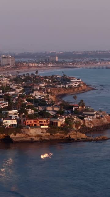 Beautiful afternoon at Windansea Beach in La Jolla with crowds enjoying the sun and beach activities at one of the most iconic beaches in San Diego | Vertical Drone Video – 10
