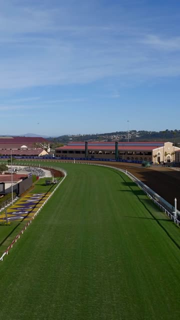 Low aerial view of the country inland, the buildings and open country in Del Mar.