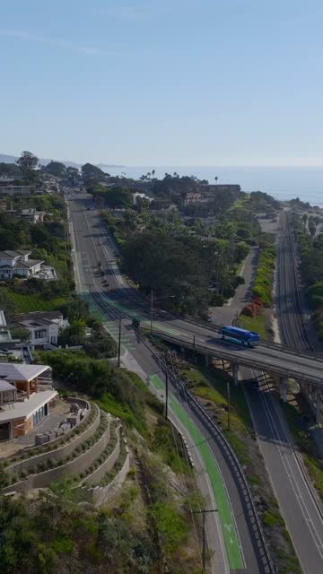 Aerial view of a residential street, the bridge and palm trees in Del Mar.