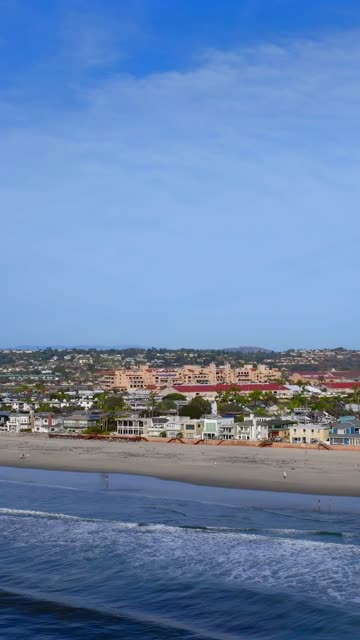Aerial view of the beach, the ocean and homes in Del Mar.