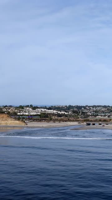 Aerial view of the beach, the surf and the ocean in Del Mar.
