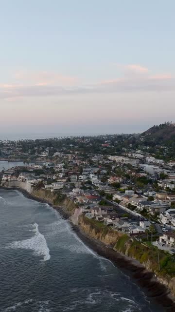 Aerial view of the cliffs, the surf and the ocean at Bird Rock.