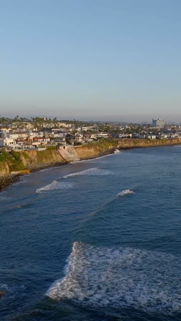 Aerial view of the cliffs, the surf and the ocean at Bird Rock.