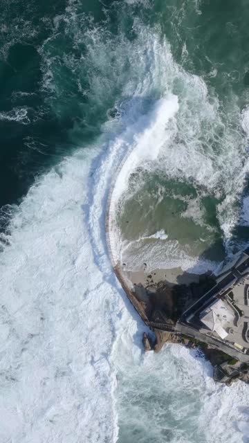 Aerial view of the beach, the surf and the ocean at Village of La Jolla.