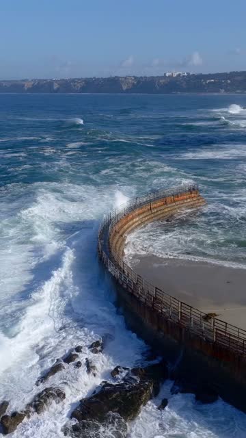 Aerial view of the beach, the surf and the ocean at Village of La Jolla.