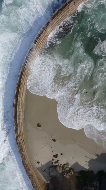 Aerial view of the beach, the surf and the ocean at Village of La Jolla.