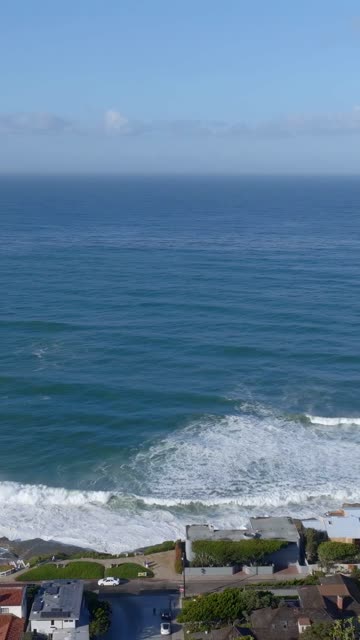 Aerial view of the beach, the surf and the ocean at Beach Barber Tract.