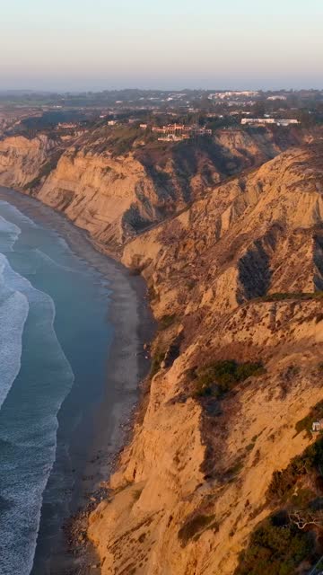 Aerial view of the cliffs, the ocean and homes at Black’s Beach.