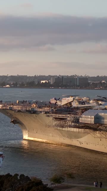 Low aerial view of the harbor, the skyline and boats at Embarcadero.