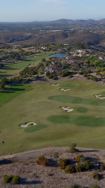 Aerial view of the country inland, homes and open country in Santaluz.