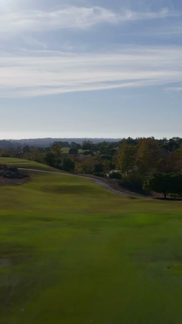 Low aerial view of a park and open country in Santaluz.