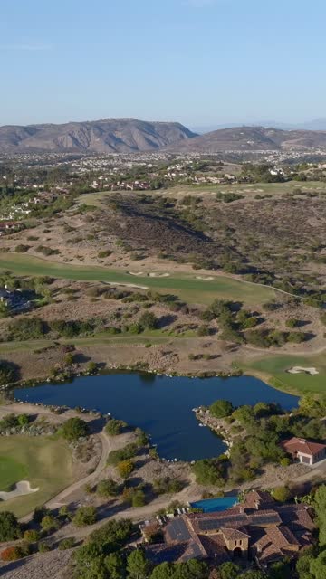 Aerial view of the country inland, homes and open country in Santaluz.