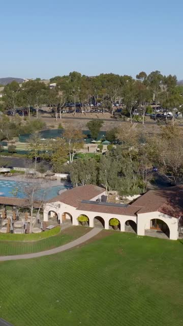 Aerial view of a park, the buildings and traffic in Santaluz.