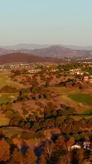 Aerial view of the country inland, homes and open country in Santaluz.