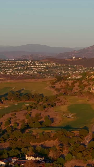 Aerial view of the country inland, homes and open country in Santaluz.