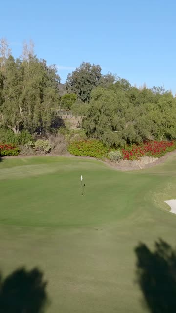 Low aerial view of a park and open country at The Bridges.