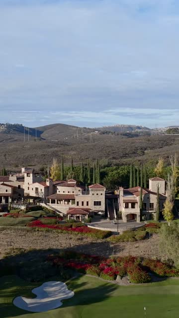 Aerial view of the country inland, palm trees and homes at The Bridges.
