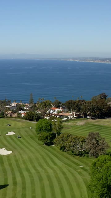 Aerial view of the country inland, palm trees and the ocean at La Jolla Country Club.