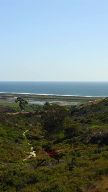 Elevated view of the country inland, the ocean and the beach in Cardiff.