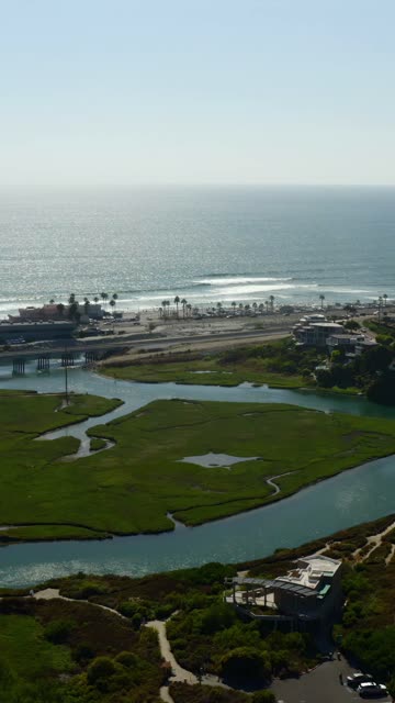 Aerial view of the country inland, the surf and palm trees in Cardiff.